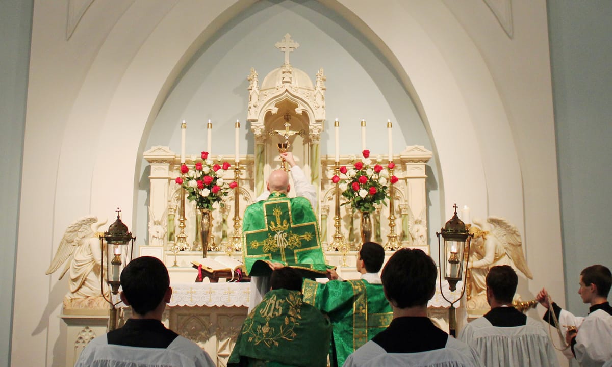 Chalice Elevation at Latin Mass - Catholic Stock Photo