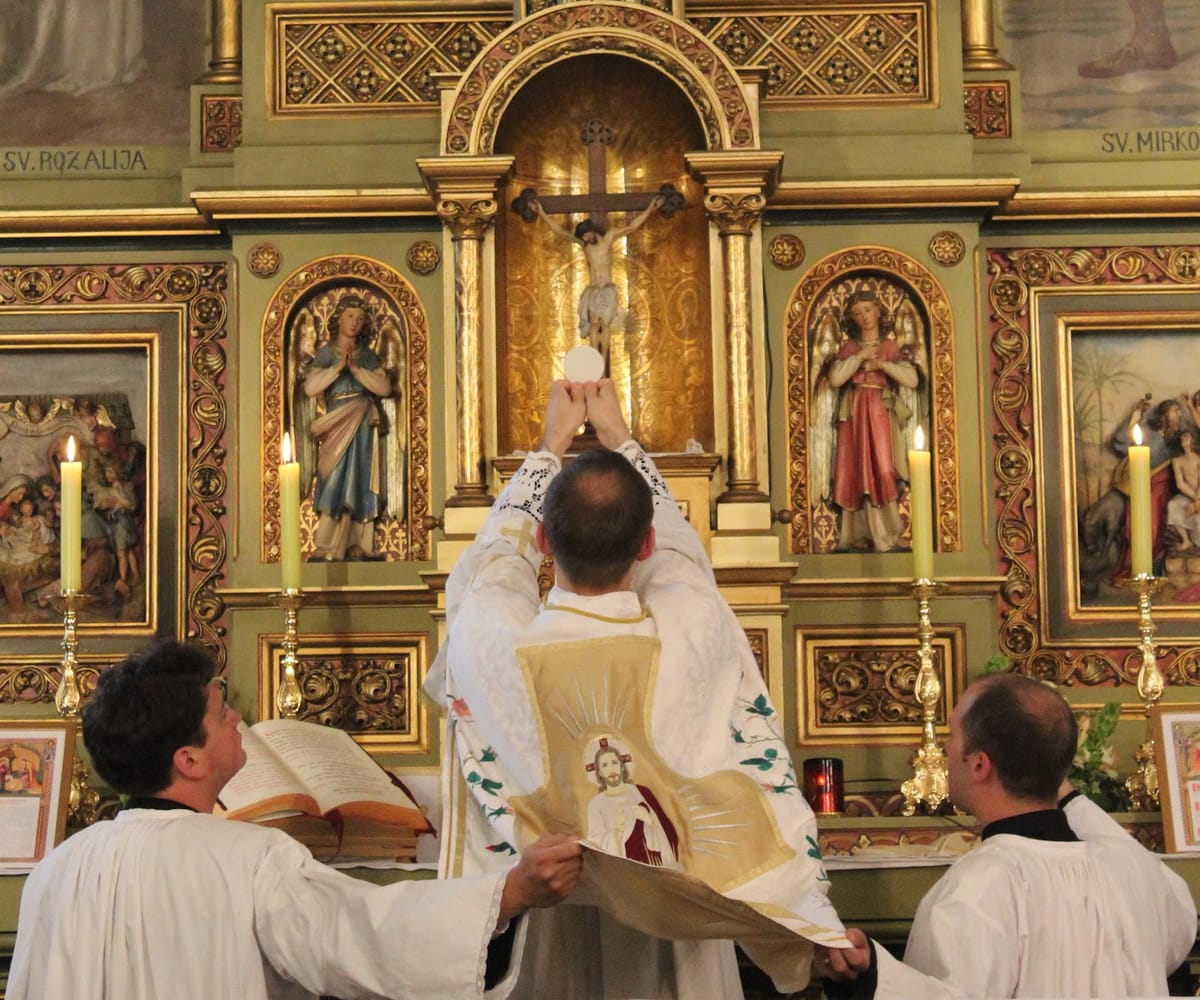 Elevation of the Host at Latin Mass - Catholic Stock Photo