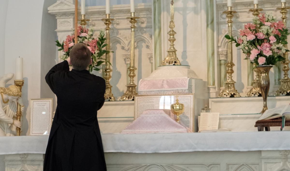 Altar Boy Lighting Candles - Catholic Stock Photo