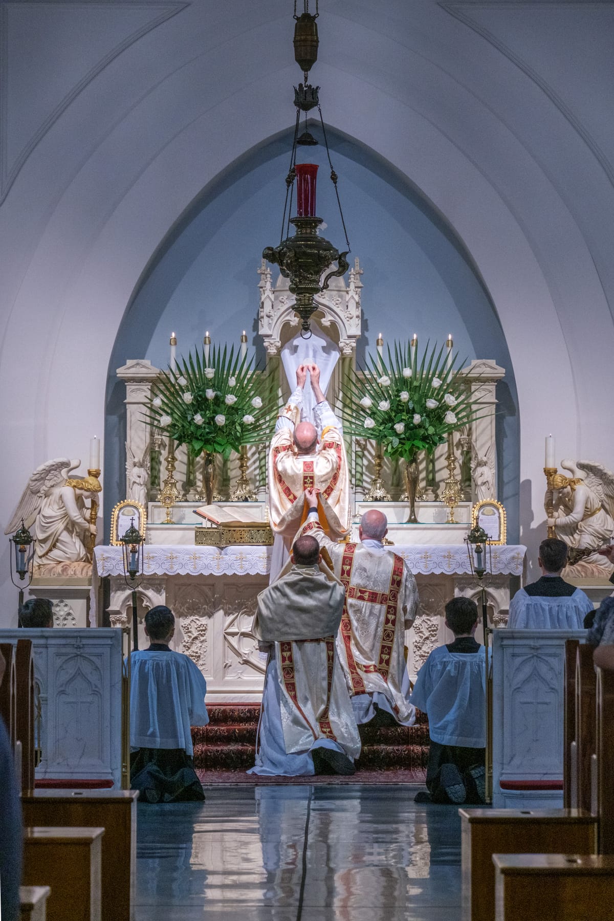 Consecration and Elevation on Holy Thursday, Latin Mass, 2023 (Saint Benedict's Parish, Chesapeake, Virginia, United States) - Catholic Stock Photo